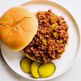 Steaming, saucy Sloppy Joes piled high on soft hamburger buns, perfect for a casual weeknight meal.