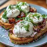 Sweet peaches and burrata drizzled with honey on golden toast, an elegant spring brunch appetizer.  